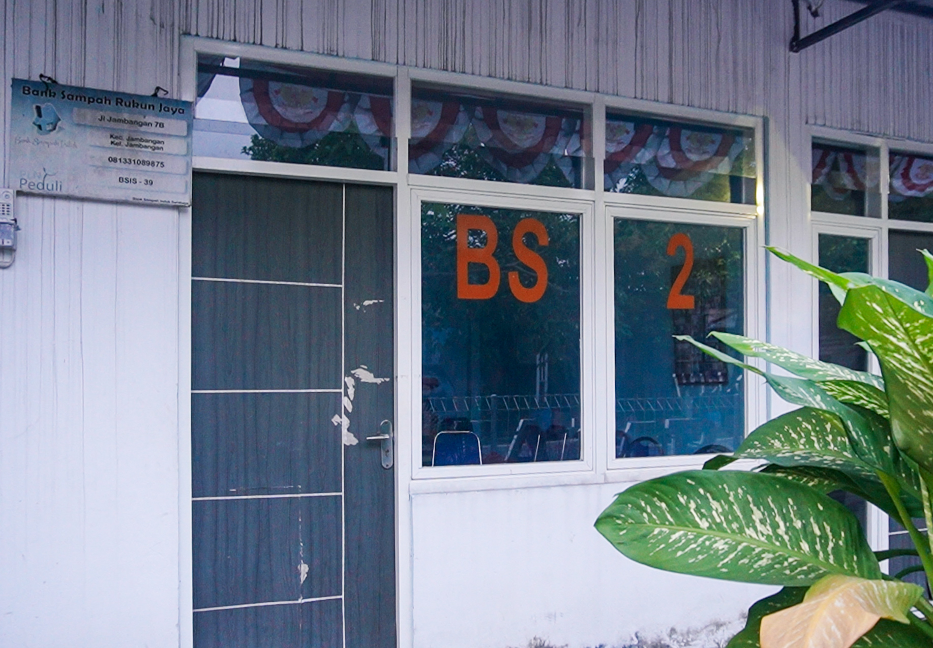 Small building with blue door and windows labeled BS 2