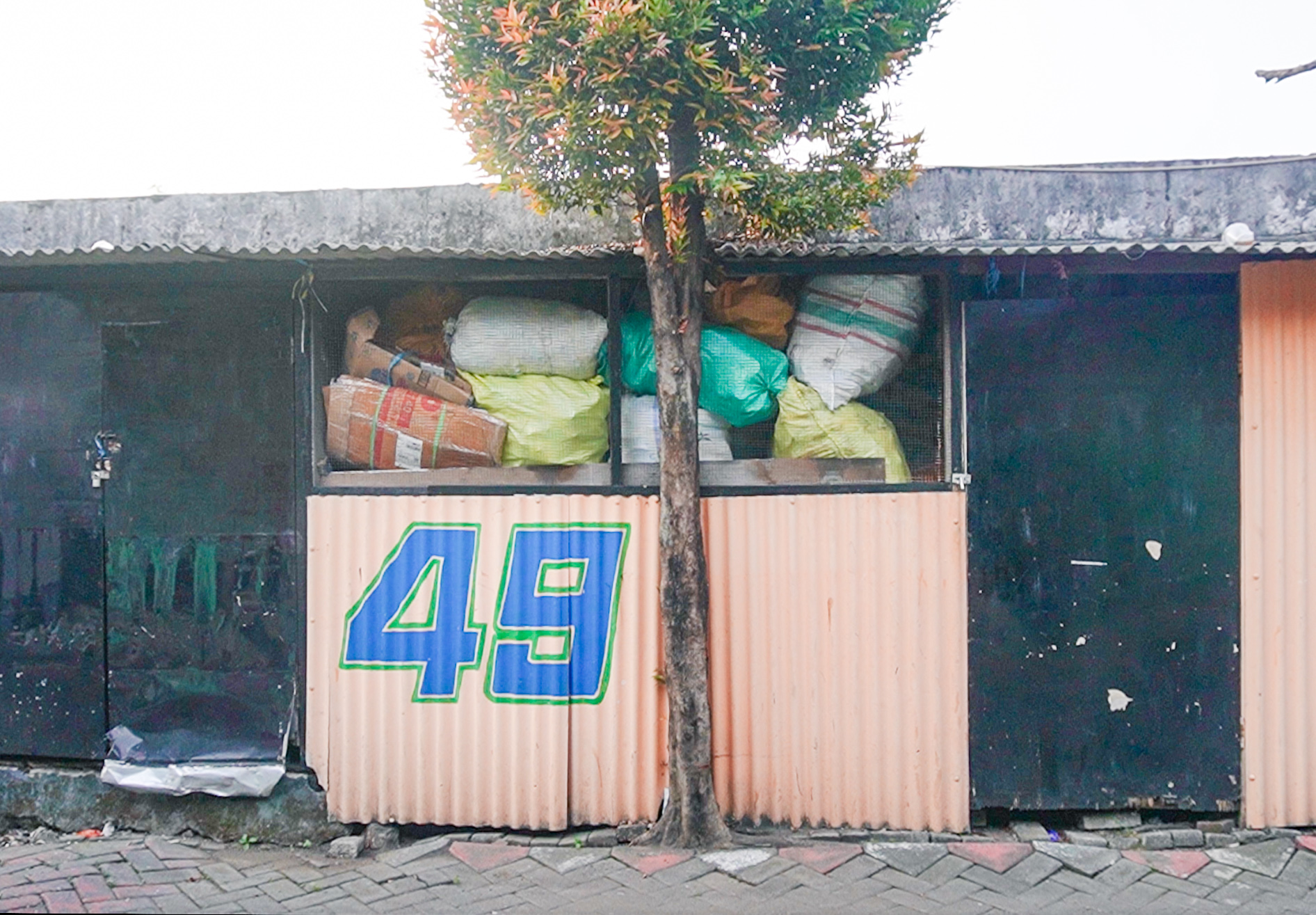 Small building with number 48 on front